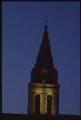 Cergy. - Église Saint-Christophe : vue sur le clocher prise à la nuit tombante.